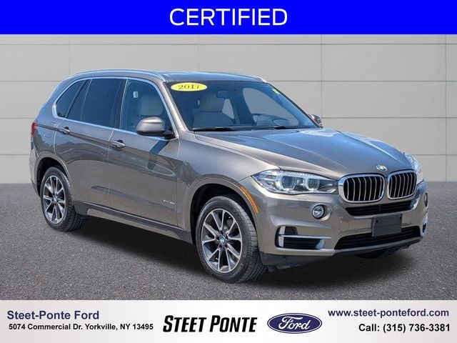 2017 BMW X5 xDrive35i in Atlas Cedar Metallic — front three-quarter view